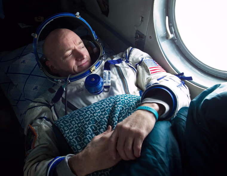 Expedition 26 Commander Scott Kelly looks out the window of a Russian Search and Rescue helicopter before the two hour helicopter ride to Kustanay, Kazakhstan shortly after he and fellow crew members Oleg Skripochka and Alexander Kaleri landed in their Soyuz TMA-01M capsule near the town of Arkalyk, Kazakhstan on Wednesday, March 16, 2011.  NASA Astronaut Kelly, Russian Cosmonauts Skripochka and Kaleri are returning from almost six months onboard the International Space Station where they served as members of the Expedition 25 and 26 crews. Photo Credit: (NASA/Bill Ingalls)