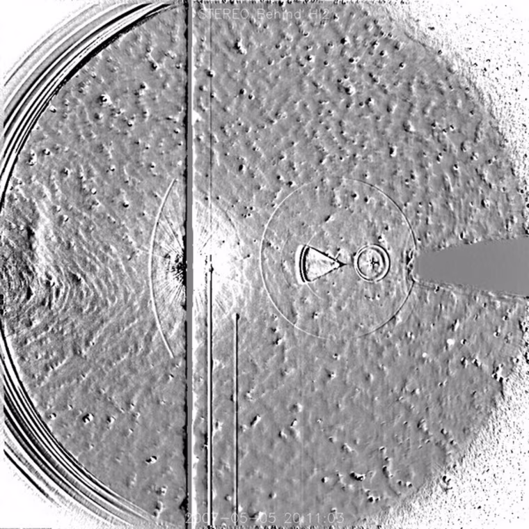 Internal reflections of the planet Earth, as seen in the HI2-B telescope on May 5, 2007. Also visible are the moon, and the planet Mars.