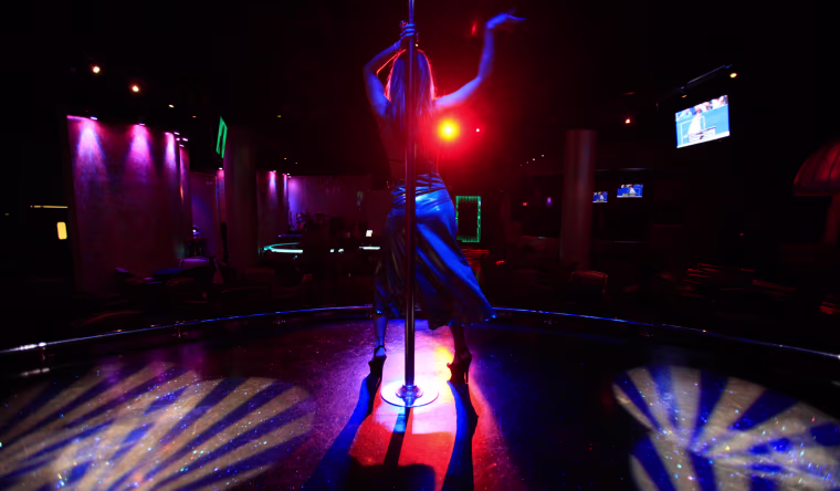 Image: Rebecca Brown begins her first three-song set of the evening at the Pink Monkey gentlemen's club in Chicago