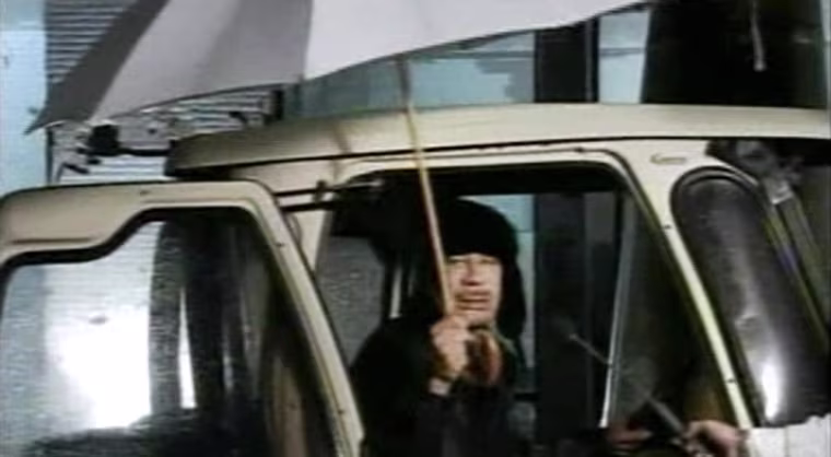 Image: Libyan leader Moammar Gadhafi appears on state television early Tuesday to say he is in Tripoli, not Venezuela, as protests calling for his ouster continue.