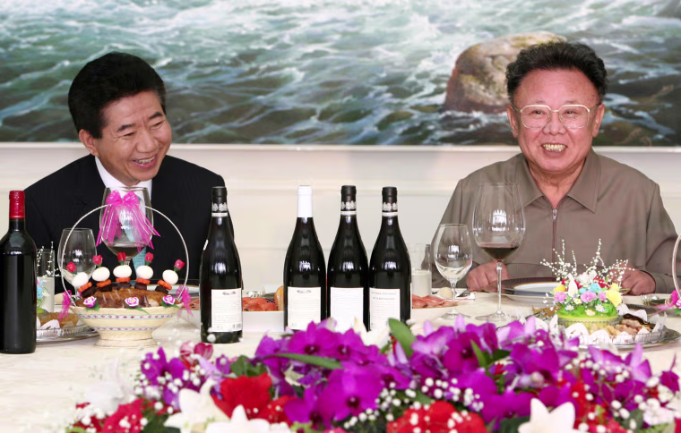 South Korean President Roh Moo-hyun, left, smiles with North Korean leader Kim Jong Il at a farewell lunch in Pyongyang, North Korea, Thursday, Oct. 4, 2007. The leaders of North and South Korea signed a wide-ranging reconciliation pact Thursday pledging to finally seek a peace treaty to replace the 54-year-old cease-fire that ended the Korean War. (AP Photo/ Korea Pool via Yonhap) **KOREA OUT**