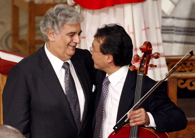 Image: Tenor Placido Domingo hugs cellist Yo-Yo Ma after they performed during funeral of U.S. Senator Kennedy in Our Lady of Perpetual Help Basilica in Boston