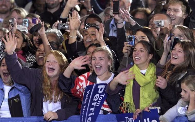 The crowd reacts as President Barack Obama arrives for a rally for Rep. Tom Perriello, D-Va., Friday, Oct. 29, 2010, at the Charlottesville Pavilion in Charlottesville, Va.  (AP Photo/Susan Walsh)