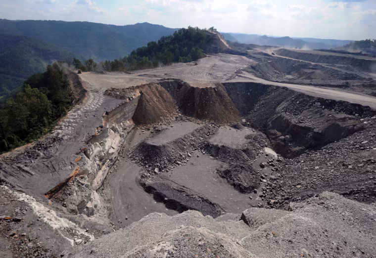 **ADVANCE FOR WEEKEND EDITIONS OCT. 25-26** A mountaintop removal mining site at Kayford Mountain, W.Va. with Coal River Mountain, left, in the background, Thursday, Sept. 18, 2008. By the mid-1700s, coal's potential had been discovered, and by the middle of the next century, mining was big business. Since record-keeping began in 1836, more than 13 billion tons have been dug from West Virginia alone, and the state remains the nation's second-largest producer behind Wyoming. (AP Photo/Jeff Gentner)