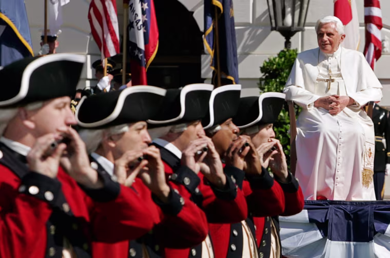 Image: Pope Benedict XVI listens to a band on the South Lawn of the White House
