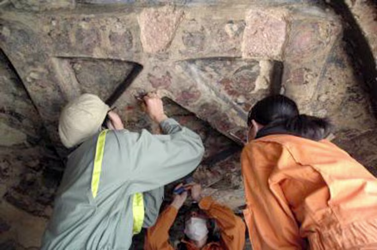 Image: Researchers take samples from caves