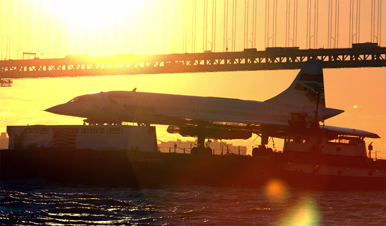 The British Airways Concorde passes under the Verrazano Narrows Bridge, at the mouth of upper New York Bay, Tuesday, Nov. 24, 2003 on its way to the Intrepid Sea Air Space Museum. The 88-ton supersonic jetliner will become the newest and most exotic addition to the museum's aircraft collection. (AP Photo/Ramin Talaie)