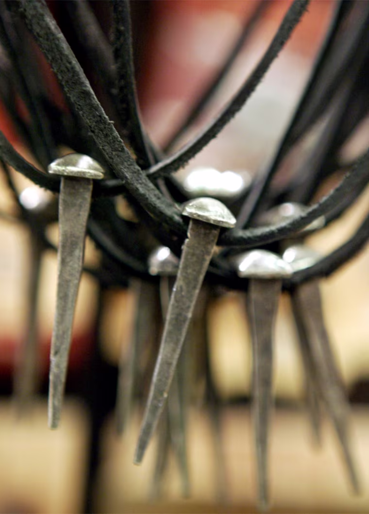 'Nail' pendants, some of