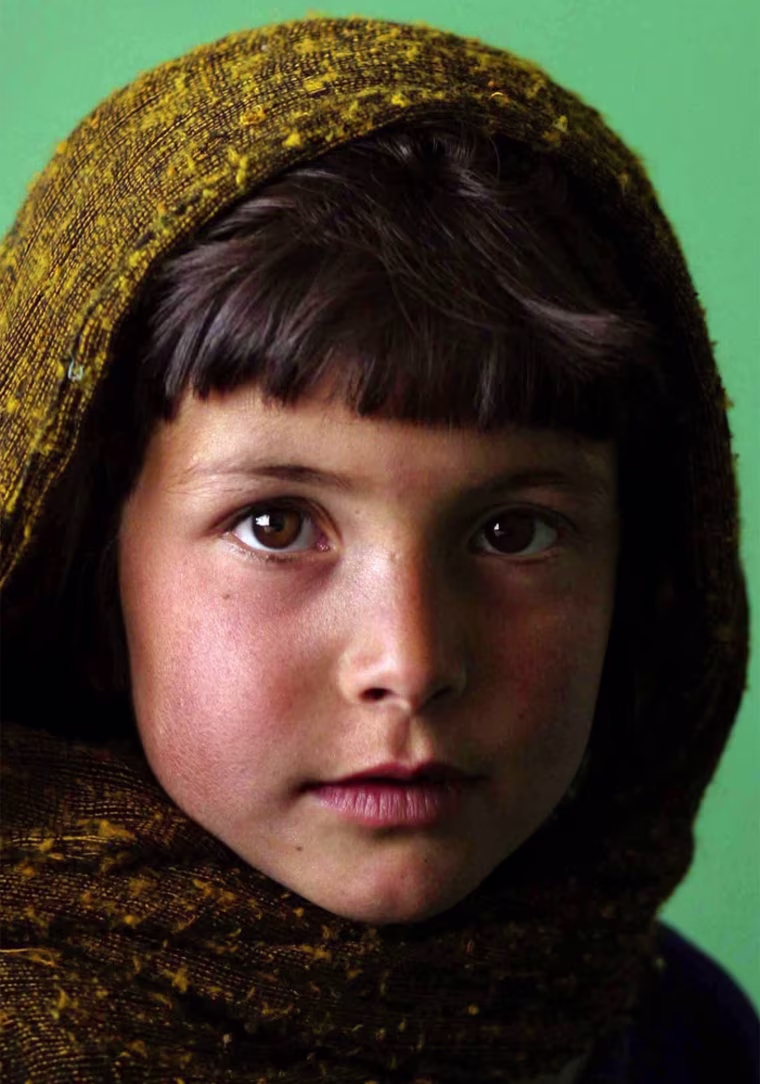 March 15, 2004 Yet another city once destroyed by the Taliban, Karabagh is trying to remend.&nbsp; With a recently opened medical clinic and its vibrant market area, the residents of this small area are attempting to rebuild what once was lost.&nbsp;&nbsp;&nbsp;&nbsp; Portrait of a young Karabagh village resident as she waits, with her mother, for medical treatment for her younger sibling at the village medical clinic.&nbsp; StaffPhoto imported to Merlin on&nbsp; Tue Mar 16 06:30:09 2004