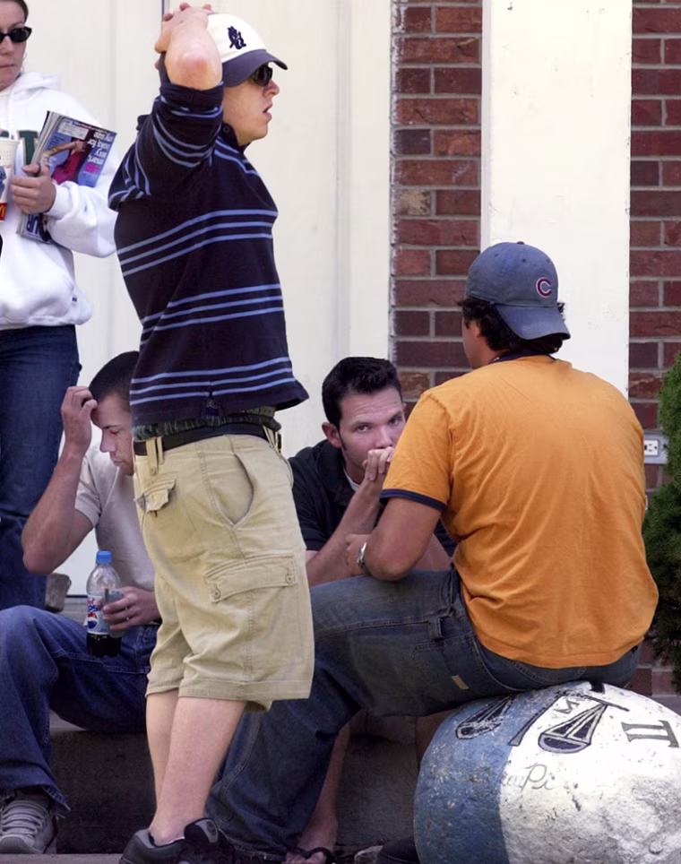 Students gather outside the Sigma Pi fraternity house in Fort Collins, Colo., Monday, Sept. 6, 2004. Police suspect drinking contributed to the death of a Colorado State University student whose body was discovered over the weekend in the Sigma Pi fraternity house.  It's not clear what Samantha Spady, 19, a sophomore business major from Beatrice, Neb., was doing in the Sigma Pi fraternity. Her body was discovered Sunday evening in a lounge by a fraternity member giving a tour of the house to his mother. (AP Photo/Dennis Schroeder, Pool)