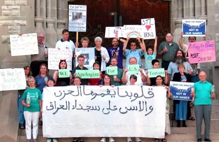 This group from St. Louis, Missouri submitted this undated  photo to the Fellowship of Reconciliation of Nyack, N.Y., which made it available Friday, Oct. 15, 2004. More than 2,000 people bemoaning the war in Iraq, including teachers, lawyers and the father of a beheaded American, are sending pictures of themselves and their protest signs to Iraq to show civilians there \"what Americans are really like.\" (AP Photo/Fellowship of Reconciliation)