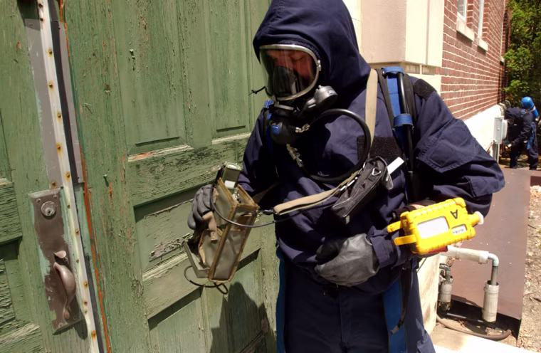 JUNE 21-FT. DEVENS, MA: A member of the 1st Civil Support Team-Weapons of Mass Destruction (CST) uses a device to test for radiation and chemical substances June 21, 2005 during a mock terrorism drill at Ft. Devens, Massachusetts. (Photo by Darren McCollester for MSNBC)