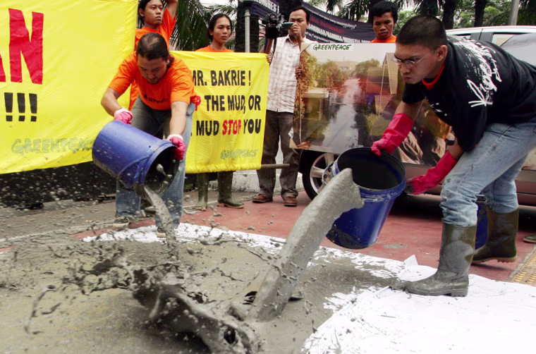 Indonesian environmental activists from Greenpeace protest in Jakarta