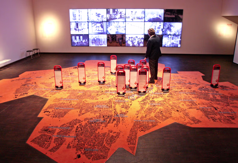 A woman stands on a huge city map inside an installation during the presentation of the new Jewish Museum in Munich, southern Germany on Wednesday, March 21, 2007. Just blocks from where Joseph Goebbels ordered the destruction of Munich's main synagogue on Kristallnacht, the city is opening a $18 million (13.5 million) museum dedicated to the heritage and the future of its growing Jewish community.(AP Photo/Uwe Lein)