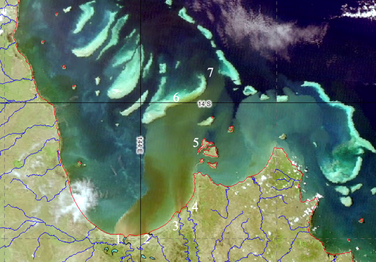 A satellite image from CSIRO shows brown and green river runoff sediment flowing across the the Great Barrier Reef