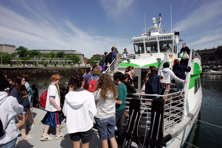 ** FOR IMMEDIATE RELEASE **People board a ferry to go to  Spectacle Island, a former trash dump now advertised as the jewel of the Boston Harbor islands, at the Long Wharf in Boston, Thursday, June 7, 2007.  (AP Photo/Chitose Suzuki)
