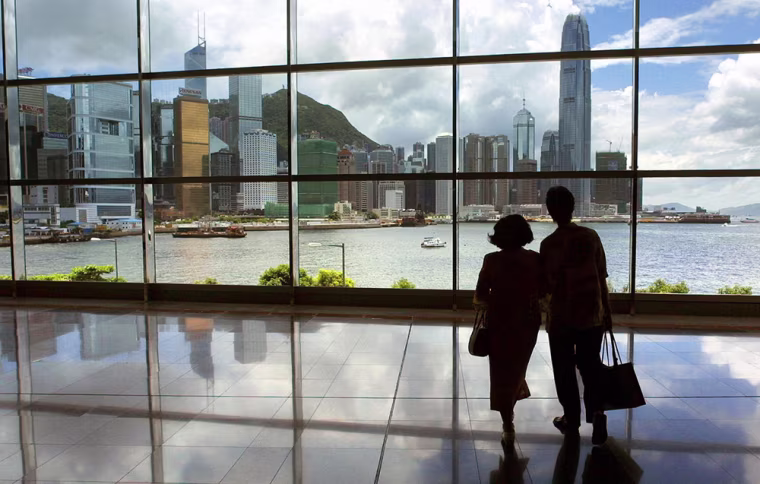 Two women look out from the Hong Kong Co