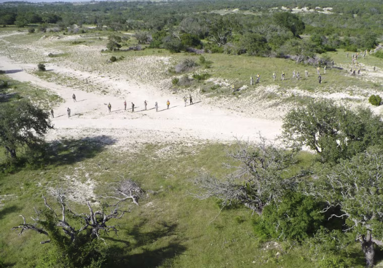 **FILE**In this photo released by Fort Hood, soldiers search for U.S. Army Sgt. Lawrence G. Sprader in this June 12, 2007, file photo in Fort Hood, Texas. Sgt. Sprader set out under the searing Texas sun on a map-reading exercise, carrying a cell phone in case he got hopelessly lost or fell ill in the hills and ravines of Fort Hood. He still didn't make it out alive. (AP Photo/Fort Hood, file)
