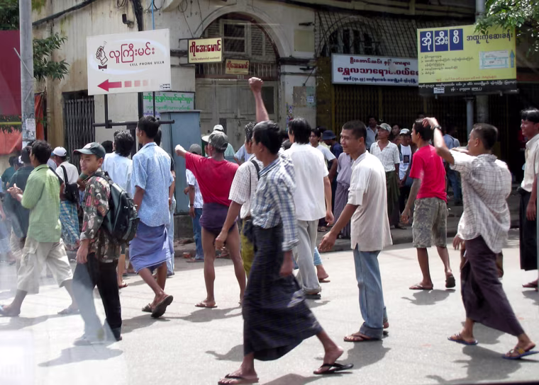Myanmar protesters taunt police and soldiers in continuing protest against the military junta Friday, Sept. 28, 2007 in Yangon, Myanmar. Myanmar soldiers fired warning shots in the air and hit protesters with clubs to break up a demonstration Friday by about 2,000 people, witnesses said.