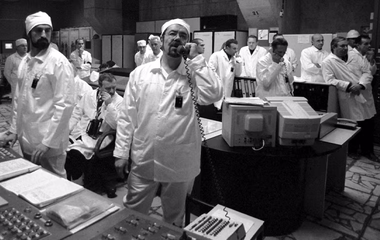 Duty engineers at the Chernobyl nuclear power plant stand at their stations moments after the plant's third reactor was shutdown in Chernobyl, Ukraine Friday Dec. 15, 2000. Chernobyl's third reactor was shut down permanently on Friday, officially closing the the plant that caused the world's worst nuclear accident in 1986. (AP Photo/Pool)
