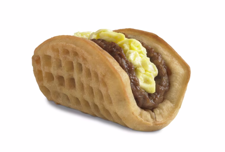 Taco Bell is starting breakfast service next month, with its new waffle taco taking aim at McDonald's Egg McMuffin.
