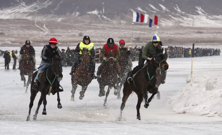 Image: Riders compete on the frozen Yenisei River during the 44th Ice Derby amateur horse race near the settlement of Novosyolovo