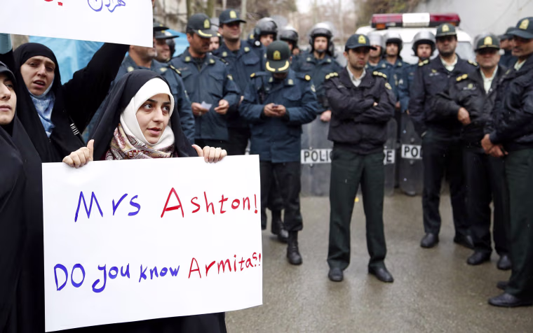Image: Students protest in Tehran on March 12 to condemn a meeting between Catherine Ashton and Iranian dissidents