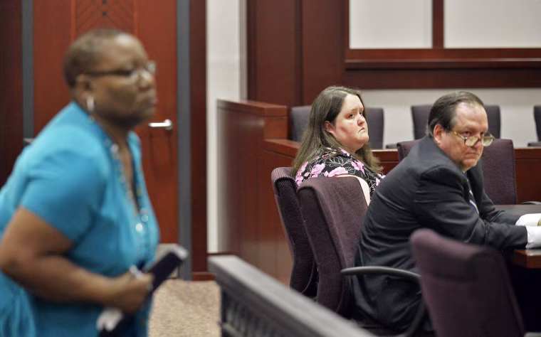 Image: Rachael Michelle Rapraeger, center