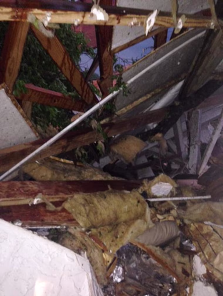 Image: Mark Ausbrooks took this image of the destruction he encountered when he and his parents emerged from a closet in their home in Mayflower, Ark.