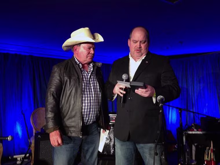 William Shatner is presented with NASA’s Distinguished Public Service medal by Bob Jacobs, NASA Deputy Associate Administrator, Communications, on April 26, 2014.