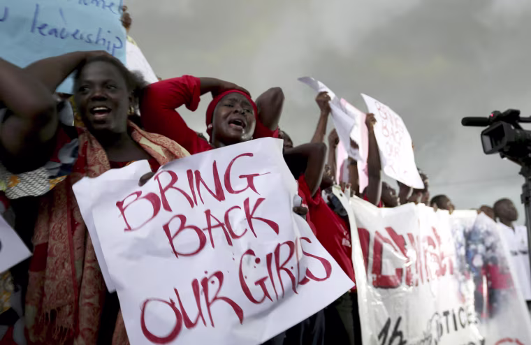 Image: Women react during a protest demanding security forces to search harder for 200 abducted schoolgirls, outside Nigeria's parliament in Abuja