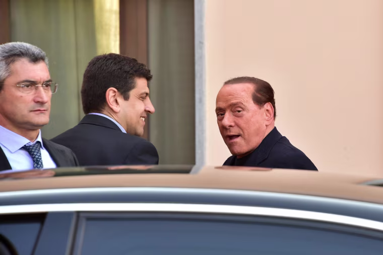 Image: Italian former Prime Minister Silvio Berlusconi arrives at the hospice