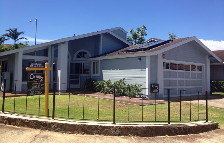 Image: A real estate sign stands in front of a home in Waipahu, Hawaii, Sunday, June 9, 2013, where Edward Snowden, source of disclosures about the U.S. government's secret surveillance programs, lived with his girlfriend until recently.