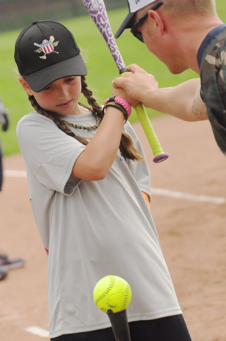 Jen Castro, 9, hits the ball.