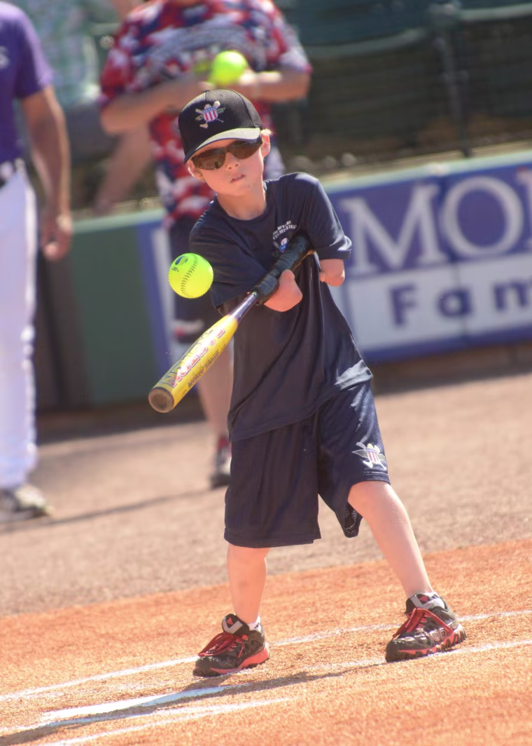 Jace Ethridge, 9, hits the ball.