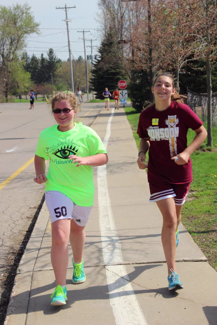 Lilly, left, at the 2014 Manchester Middle School 5K to benefit VisionWalk and Diabetes.