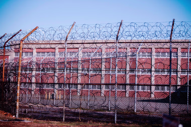 Barbed wire fences surround a building on Rikers Island Correctional Facility in New York