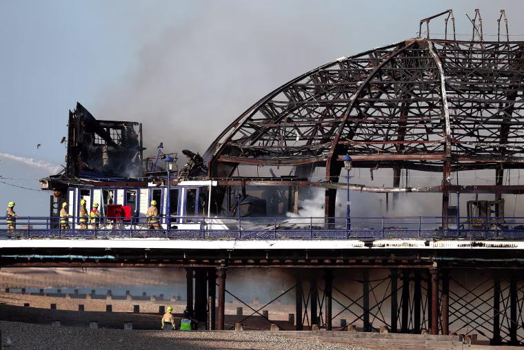 Image: The remains of Eastbourne Pier after a fire broke out in the arcade building in Eastbourne, England.