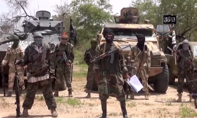 Image:A screengrab taken on July 13, 2014 from a video released by the Nigerian Islamist extremist group Boko Haram and obtained by AFP shows the leader of the Nigerian Islamist extremist group Boko Haram, Abubakar Shekau (C), referring to the Bring Back 
