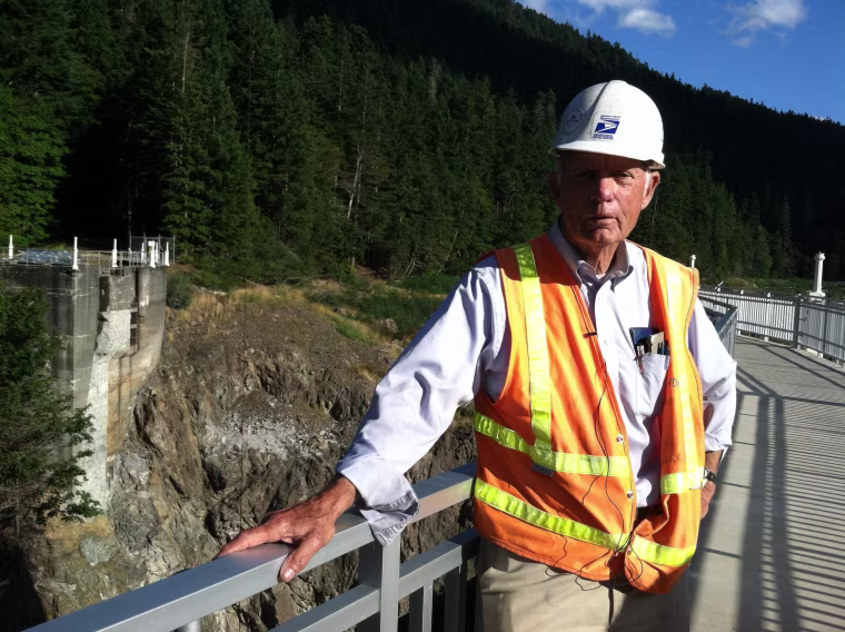 Image: Construction manager Don Laford stands on what remains of the Glines Canyon Dam.
