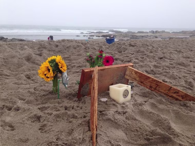 A memorial on a Lincoln City, Oregon, beach for 9-year-old Isabel Grace Franks, who died in a sand collapse Friday.