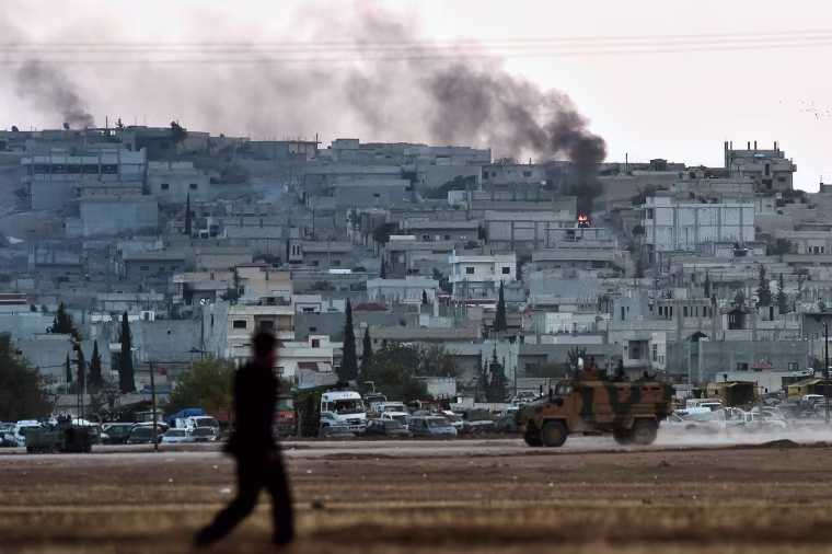 Image: Smoke rises from the city centre of the Syrian town of Ain al-Arab