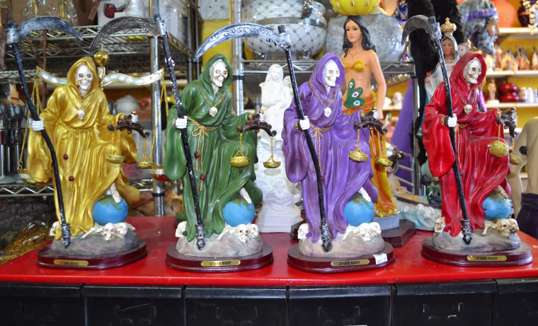 Image: Statues of Santa Muerte for sale at EL Viejo Lazaro Botanica