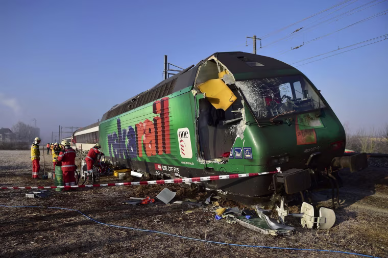 Image: Rescue workers inspect the site of a train crash