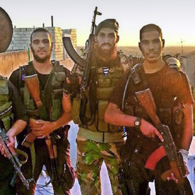 From left, Mohammed el-Araj, Yilmas a former soldier from Holland, and Choukri Ellekhlifi pose in Syria. El-Araj and Ellekhlifi were London associates of Jihadi John.