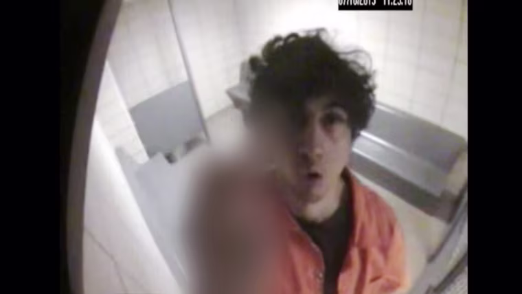 Image: Video recorded in a jail cell in 2013 a few months after the bombing shows Dzhokhar Tsarnaev flashing his middle finger to the camera.