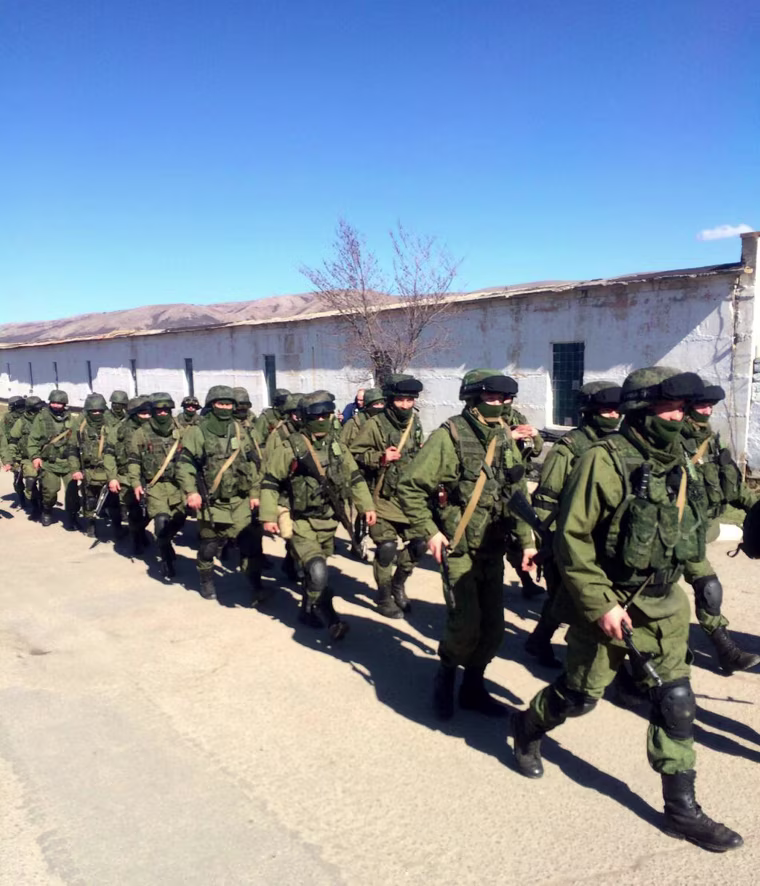 Image: Russian troops during shift change outside Privolnoye military base in Crimea, Ukraine.