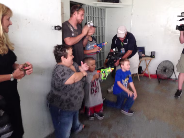 Spencer "battles" zombies at the jail.