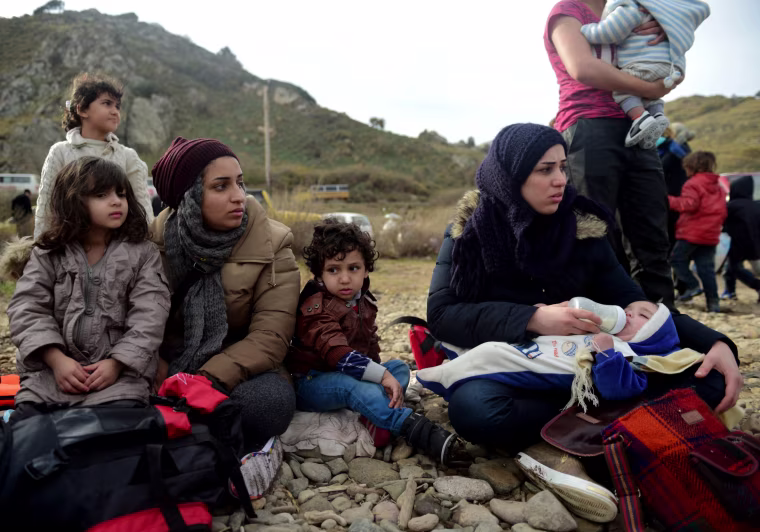 Image: Migrants and refugees arrive on the Greek island of Lesbos