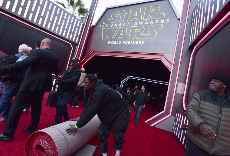 Image: Staff prepare the red carpet